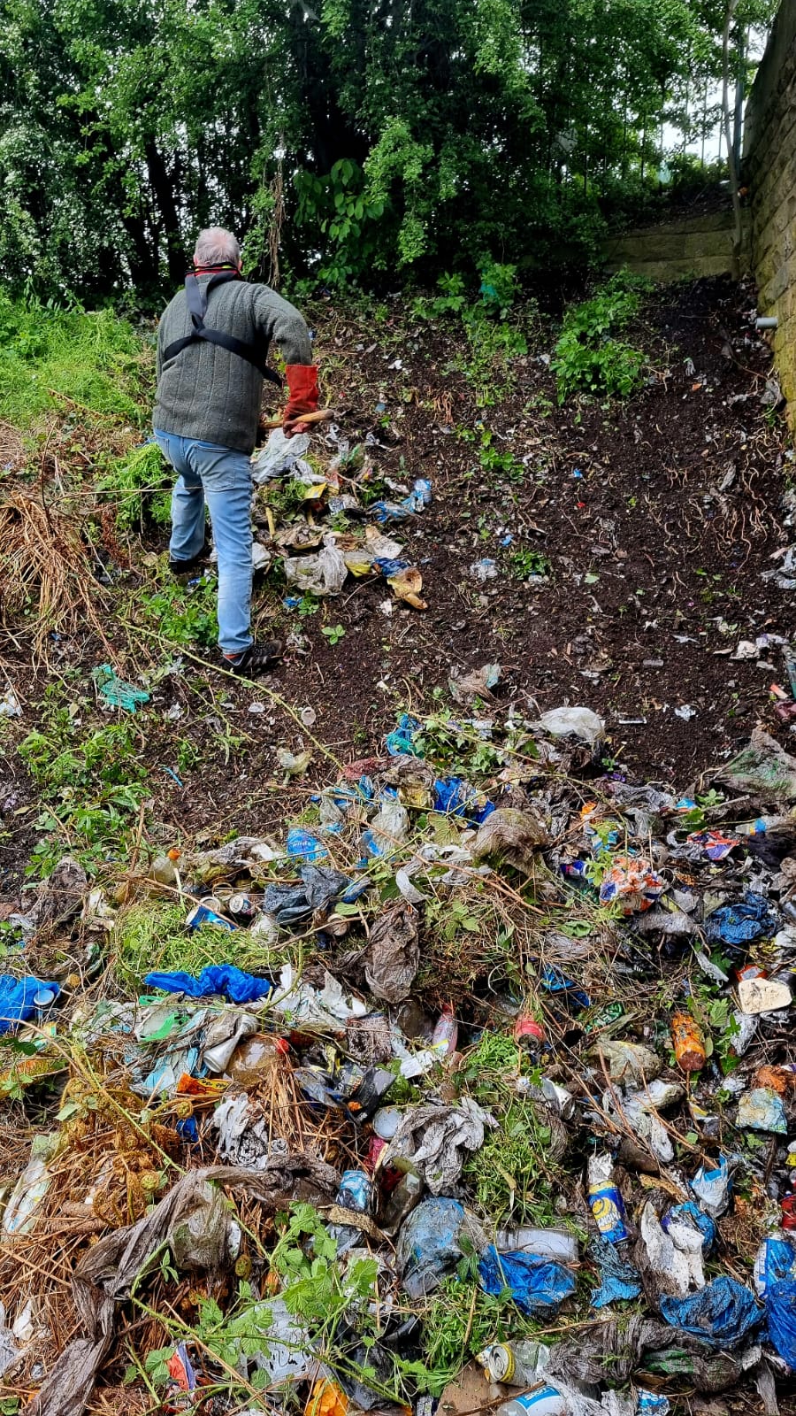 Volunteer clearing litter on the canal banks
